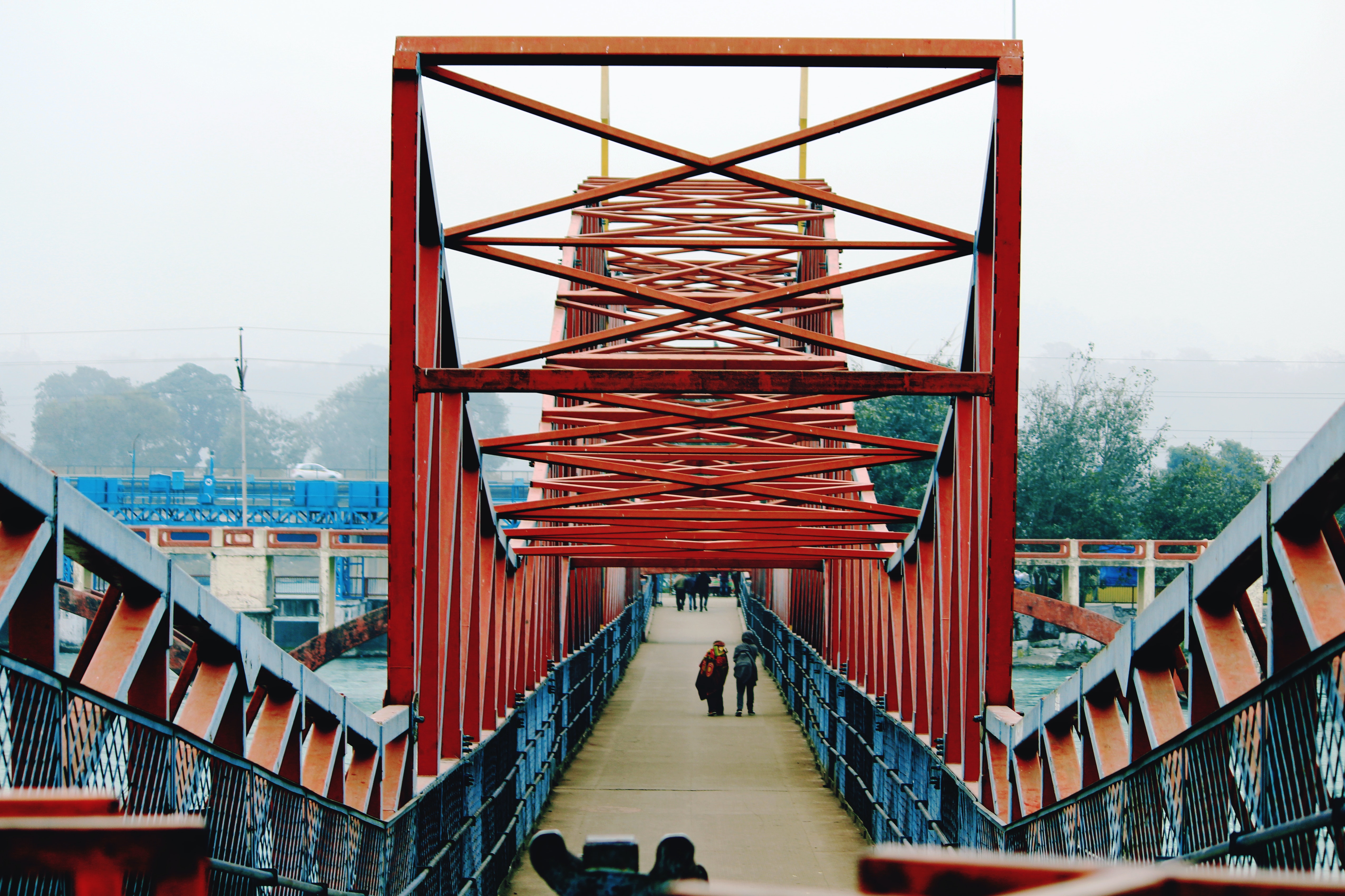 View down a red bridge, photo by Avinash Patel from Pexels