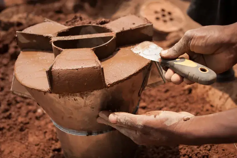 Manufacturing a Gyapa clean cookstove, Ghana © ClimateCare