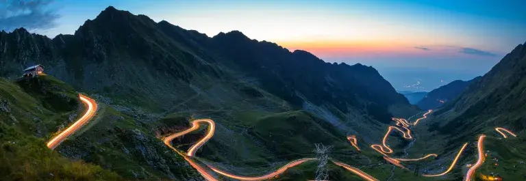 Road at night in hilly landscape