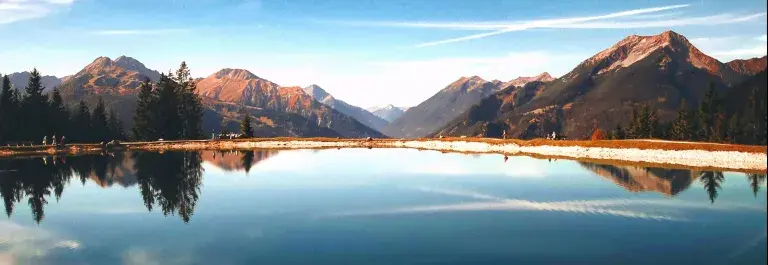 lake with mountains reflected in the background