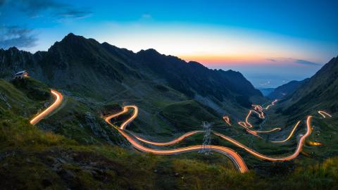 Road at night in hilly landscape